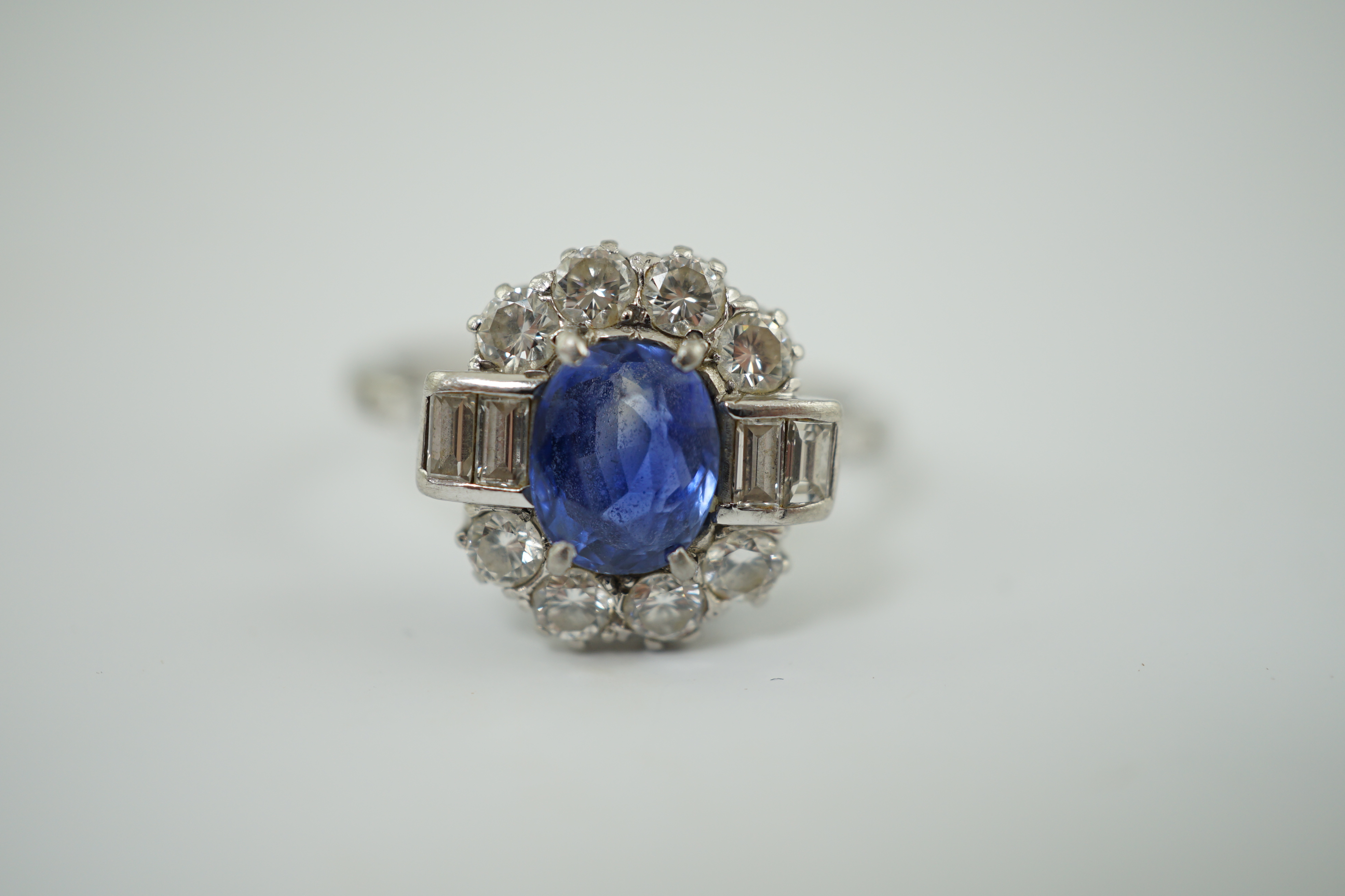 An Art Deco style platinum?, sapphire and diamond cluster ring